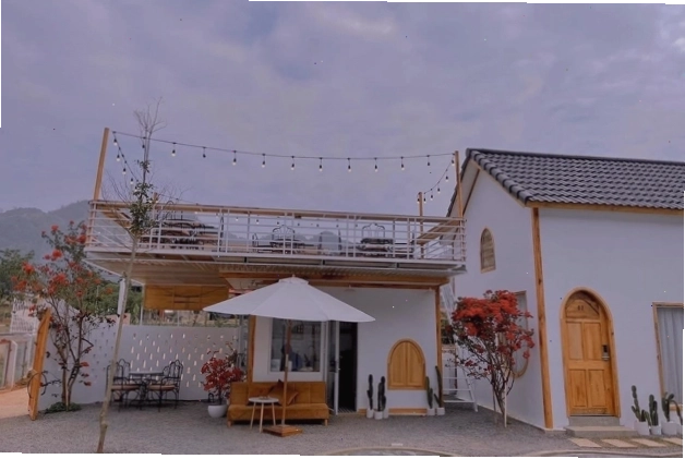 Nội thất phòng nghỉ Le Chalet du Lac Mộc Châu với giường đôi và tiện nghi hiện đại